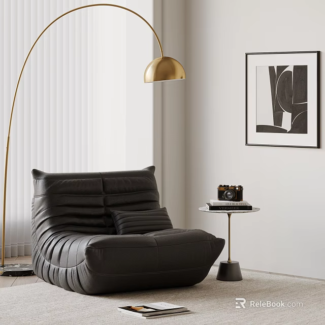 Black Bean Bag Chair with Floor Lamp Small Round Table Camera and Black White Art 3d model 