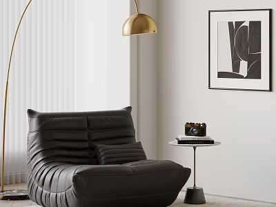 Black Bean Bag Chair with Floor Lamp Small Round Table Camera and Black White Art 3d model