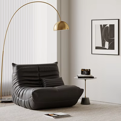 Black Bean Bag Chair with Floor Lamp Small Round Table Camera and Black White Art 3d model
