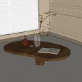 Oval Wooden Coffee Table with Open Book Glass Vase with Branches and Teapot by Window