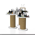 Circular Display Shelves With Rope Wrapped Bases Holding Decorative Bottles And Ornaments