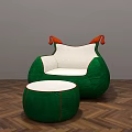 Green Armchair With White Cushion Orange Armrests And Matching Ottoman On Herringbone Wooden Floor