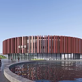 Circular Red Museum Building With Surrounding Green Spaces And Circular Pathways 3d model