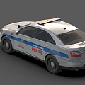 White Police Car With Blue Emergency Lights And Local Department Markings