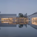 Modern Boutique Hotel Building Exterior With Pool Reflection And Evening Lighting