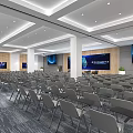 Modern Spacious Conference Room With Arranged Chairs Large Screen Decorative Paintings And Recessed Lighting