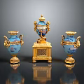 Three Blue Sculpture Carvings With Golden Decorations And Intricate Patterns On Base