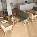 Modern Cafe Interior With Green Sofas Beige Chairs And Wooden Tables Design