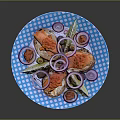 Fresh Salmon Slices with Red Onion Rings and Lemon Slices on Blue Polka Dot Plate