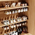 Variety Of Shoes Organized In Wooden Shoe Rack