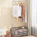Modern Clothes Rack With Hanging Clothes And Bottom Basket In Indoor Setting