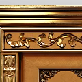 Golden And White Double Doors With Intricate Carved Designs And Decorative Frames
