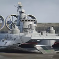 Military Hovercraft With Large Rotating Fans Radar System And Cannons On Water