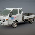 White Small Pickup Truck With Colorful Graphic Design And Open Cargo Bed