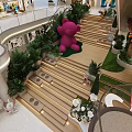 Stylish Modern Shopping Mall Hall With Cute Plush Dolls Lush Greenery And Warm Ambient Lights