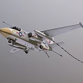 US Navy Fighter Jet Featuring White and Beige Visible Cockpit Missile Attachments Star Stripe Emblems