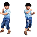 Two Young Boys In Blue T Shirts And Jeans Doing Boxing Poses