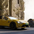 Yellow And Black Sports Cars Parked Against Old Stone Walls Background