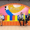 Colorful Art Mural Decorated Public Space With Archway And People Activities