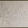 White Background Wall with Embossed Leaf Pattern and Modern Textured Decorative Design