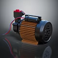 Black Electric Motor With Red Button Brown Cooling Fins And Colored Wires