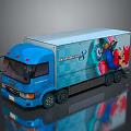 Blue Delivery Truck With Monster Clash Graphics And Colorful Cartoon Characters