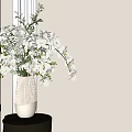 Decorative White Vase With Striped Design Holding White Orchids On Small Table Near Window