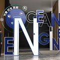 Large Modern 3D Letters Design In Interior Space With Blue Tech Elements And Human Figure 3d model