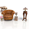 Vintage Brown Leather Armchair Interior With Stacked Books Small Lamp Pink Flower Vase And Sculptures