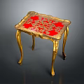 Elegant Carved Table With Golden Legs Red Tabletop And Intricate Golden Patterns