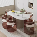 Modern Oval White Dining Table with Six Brown Chairs Adorned with Lemons and Green Plant
