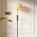Modern Floor Lamp With Beige Fabric Shade And Dark Wooden Stand Near Green Palm Plant