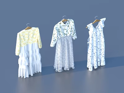 Three Stylish Clothes Hanging On Hangers With Yellow Top And Floral Dresses 3d model