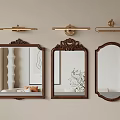 Three Decorative Mirrors with Ornate Wooden Frames on Light Beige Wall and Brass Wall Sconces