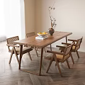 Wooden Dining Table Set with Woven Chairs Vase Flowers and Fruit Plate in Bright Interior