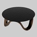 Modern Round Coffee Table With Black Textured Tabletop And Curved Wooden Legs