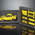 Yellow Car Model in Open Box with Compartments Holding Various Car Parts