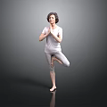 Woman Practicing Yoga Tree Pose With Hands In Prayer On Black Floor