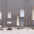 Modern Golden Metal Clothes Racks for Retail Display with Hanging Dresses Mirrors and Accessories