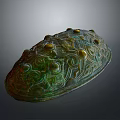 Ancient Bronze Sculpture With Intricate Carved Patterns And Protruding Decorative Studs