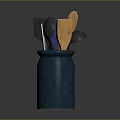 Blue Ceramic Jar With Various Kitchen Utensils Including Black And Wooden Tools