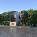 Modern Commercial Outdoor Vending Machine With Woman Standing Beside Surrounding Greenery