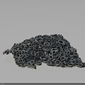 Tire Sculpture With Stacked Tires And Green Plants On Dark Background