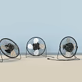 Three Tabletop Air Conditioner Fans With Black Silver Design And Metal Stands