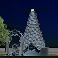 Giant Colorful Light Up Tree Decoration With Archway And Night Sky Background