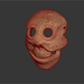 Ancient Clay Mask Featuring Prominent Eye Holes And Primitive Facial Design