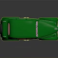 Vintage Green Classic Car With Rounded Body Spare Tire And Retro Design
