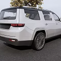 Silver SUV With Modern Exterior Design Parked Near Tree Featuring Front Grille And Alloy Wheels