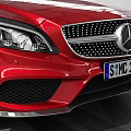 Red Mercedes-Benz Sedan Parked In Spacious Indoor Garage With Tire Tracks On Floor