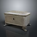 Intricately Carved Decorative Chest With Ornate Patterns Lid And Sculpted Feet Design
